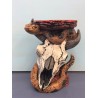 cow skull with snake